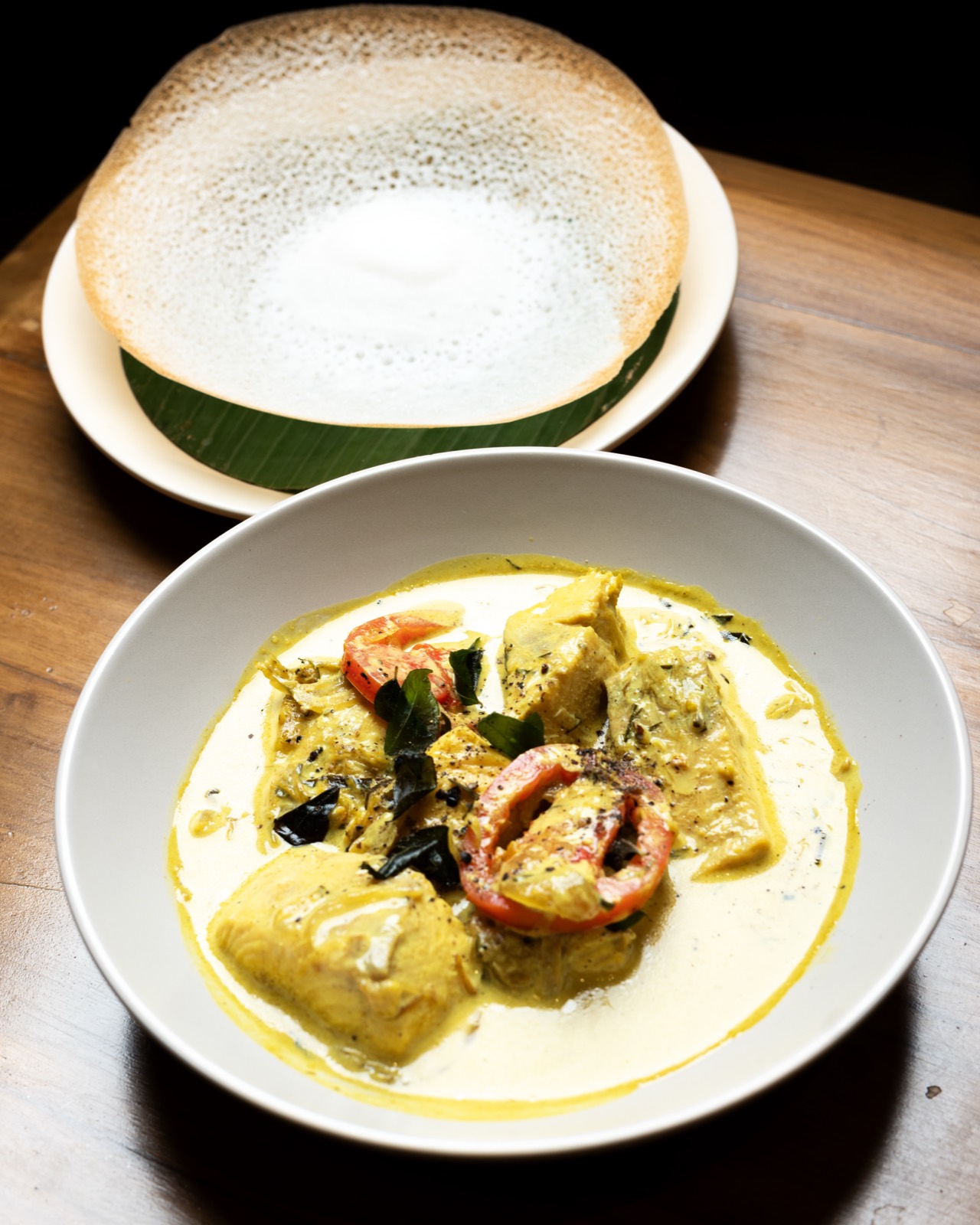 Appam and coconut fish curry